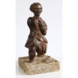 An 18th Century carved oak figure, depicting a gentleman with his left arm raised to a cross on