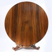 A William IV rosewood breakfast table, the circular top above a inverted tapered fluted column and