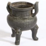A Chinese bronze tripod censer, the neck and bulbous body with geometric line decoration, raised
