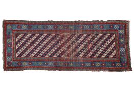 A South Caucasian Genje runner rug, having a blue red and cream ground set with the diagonal rows
