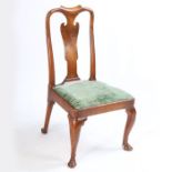 A George I oak side chair, with an arched top rail above the vase splat and drop in seat raised on