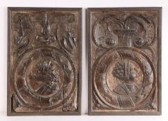 A pair of 17th Century framed Romayne panels, with fleur de lis and scroll carved pediments above