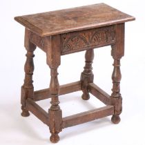 A 17th Century and later oak joint stool, the rectangular top above a lunette carved frieze and