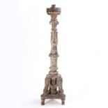 An 18th Century Italian silvered torchiere, with ribbon swags and arched supports above the