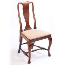 A George I red walnut chair side chair, the arched top rail above a vase splat and drop in seat