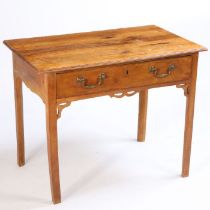 A George III lowboy, the rectangular top above a single frieze drawer and square section legs with