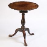 A George III mahogany occasional table, the pie crust top above a bird cage action and turned column