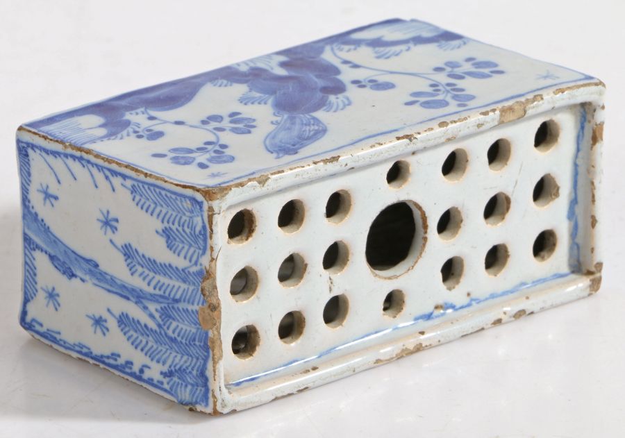 An 18th Century Delft flower brick, with foliate decorated front and back flanked by willow tree - Image 2 of 2
