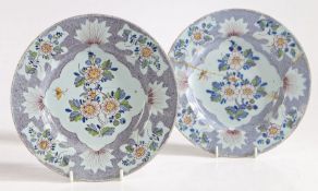 A pair of 18th Century Delft plates, possibly Bristol, circa 1750, with polychrome foliate