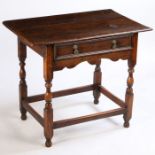 A late 17th Century oak side table, the rectangular top above a frieze drawer and shaped apron above