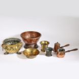 Copper and brass ware to include a twin handled copper pedestal bowl, a brass jardiniere with lion