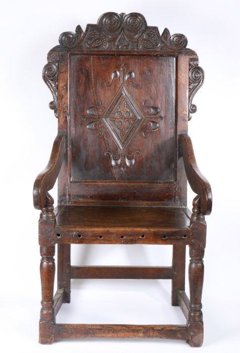 A 17th Century and later oak wainscot, Yorkshire, with a scroll carved arching crest above a diamond - Image 4 of 4