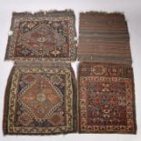 Three Soumak bags, each with different designs, the largest 122cm by 52cm