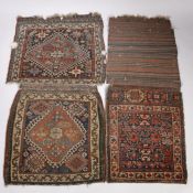 Three Soumak bags, each with different designs, the largest 122cm by 52cm