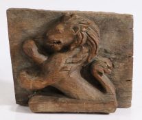 A 19th Century carved oak lion rampant, 25cm wide, 19.5cm high