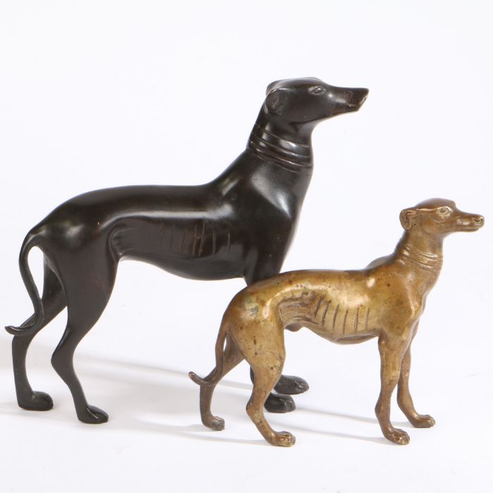 Two bronze greyhounds, modelled in standing positions, the larger 20cm high, 22cm wide, the