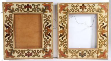 A pair of Arts & Crafts style picture frames, with foliate and scroll painted borders, retailers