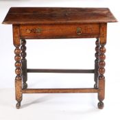 A late 17th Century fruitwood side table, the rectangular top above a long frieze drawer and