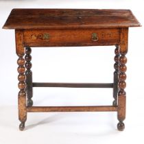 A late 17th Century fruitwood side table, the rectangular top above a long frieze drawer and