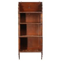 A 19th Century mahogany hanging waterfall bookcase, the waterfall shelves with bead edge and twin