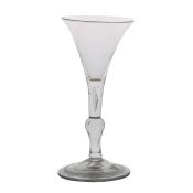 A mid 18th Century baluster wine glass, English circa 1740, the drawn trumpet bowl with two tears