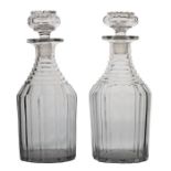 A pair of 19th Century "Nelson" decanters, with terrace cut necks and vertical cutting bodies, 25cm,