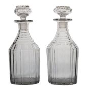 A pair of 19th Century "Nelson" decanters, with terrace cut necks and vertical cutting bodies, 25cm,