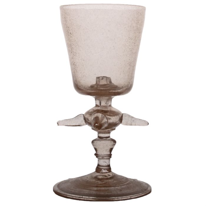 An early 18th Century "trick" glass, with a hollow central stem pieced knop with pierced tube