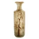 A Roman flask, 2nd - 3rd Century AD with a thick glass body of cylindrical form, and flared rim,