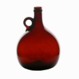 A mid 19th Century English brown glass wine flagon, circa 1840, with loop handle, 19cm tall