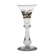 Bohemian Schwarzlot glass goblet, circa 1890, painted with a scene of a huntsman and stag, the