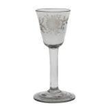 A mid 18th Century wine glass, English circa 1740-50, a round funnel bowl engraved with