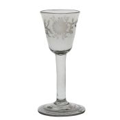 A mid 18th Century wine glass, English circa 1740-50, a round funnel bowl engraved with