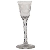 An 18th Century hexagon facet and engraved wine glass, the bowl with etched roses above a facet