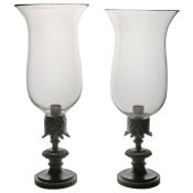 A pair of Regency candle lamps, circa 1820,  the storm shades above the classical bronze bases, 29cm