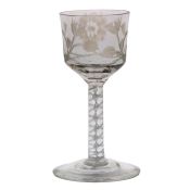 An air twist wine glass, the bowl engraved with a rose and trailing leaf above the double air