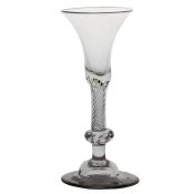 A mid 18th Century composite stem wine glass, English circa 1750, the bell bowl with multiple spiral