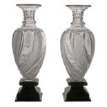 A pair of early 19th Century glass and bronze vases, circa 1810, French Empire, with arched cut