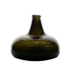A late 17th/early 18th Century English onion wine bottle, circa 1690/1700, with a dumpy stem and
