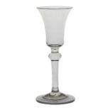 A mid 18th Century baluster wine glass, English circa 1740, with a bell bowl above a knop and