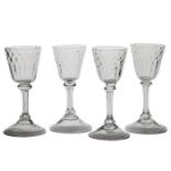 A matched set of four Liege wine glasses, circa 1730, the bowl blow moulded with honeycomb and
