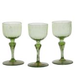 Three late 19th Century Murano wine glasses, Salviati, lime green glass with aventurine