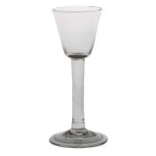 A mid 18th Century wine glass, English circa 1740, rounded bowl with plain stem and folded foot,