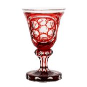 A mid 19th Century Bohemian red glass goblet, with circular windows and engraved to one side with