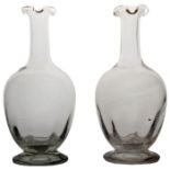 A pair of late 19th Century English carafes, circa 1880, with triple lip rims, 23cm high, (2)