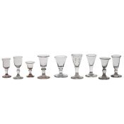 An interesting collection of nine miniature wine glasses, 19th century, the tallest 7cm (9)