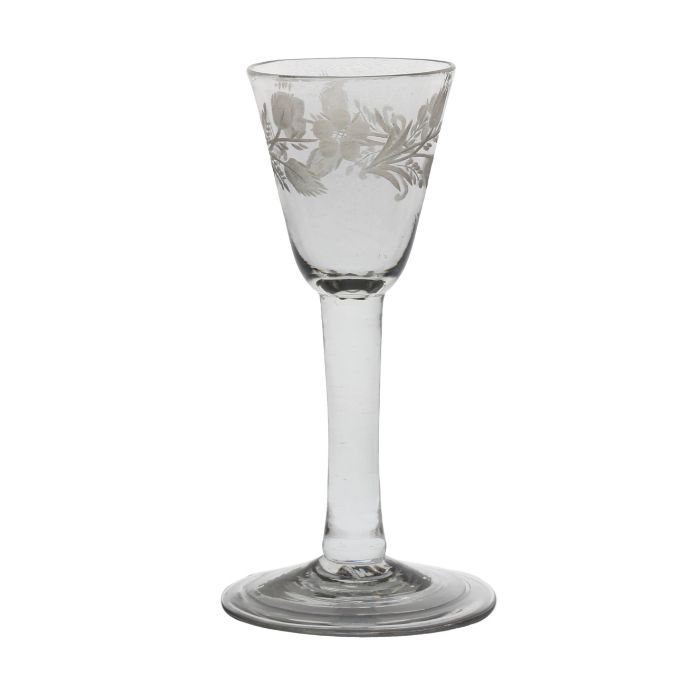 A mid 18th Century wine glass, English circa 1740-50, a round funnel bowl engraved with stylised