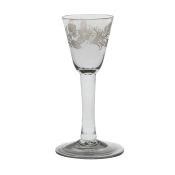 A mid 18th Century wine glass, English circa 1740-50, a round funnel bowl engraved with stylised