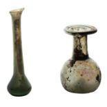 Two pieces of Roman glass, 2nd - 4th Century AD to include a small flask with flared base and