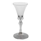A mid 18th Century baluster wine glass, English circa 1730-40, the bell bowl above a tear to the